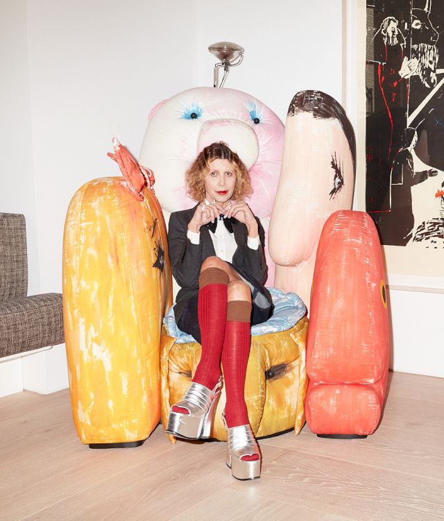 Photo by Frederike Helwig, Valeria is seated on Geatano Pesce's armchair, behind: Andrea Butttner, Nativity, 2007; limited edition by Tauba Auerbach (on a table)